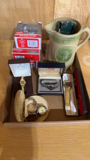 Box of misc watches, ceramic pitcher & Coca-Cola