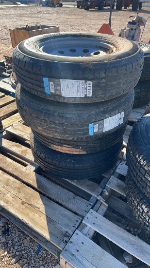 Set of 4 unused ST205/75R15 trailer tires & wheels