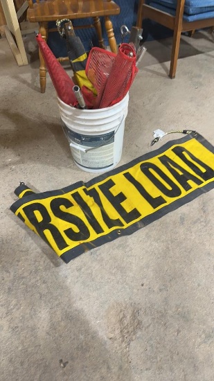 Bucket of oversize load flags & banners