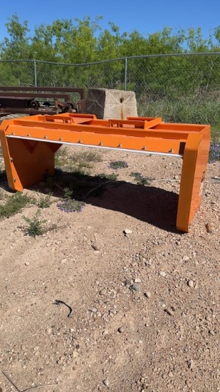 Wolverine snow pusher for skid steer