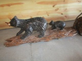 Bear and cub on log