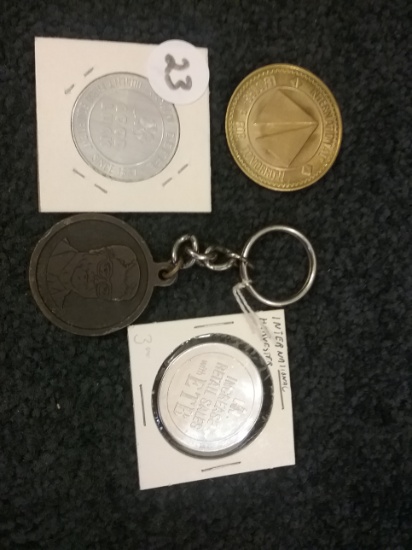 Two International Harvester Tokens, one John Deere Token, one Joe Elston…..