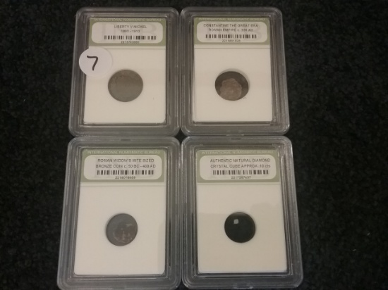 Four slabbed coins
