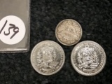 1936 Switzerland half-franc, and a 1945 and 1960 Venezuela Bolivars