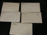 Five Mint sets in original packaging with COA