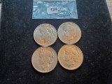 Four About Uncirculated Peace Dollars