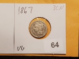 1867 Three cent nickel in very good