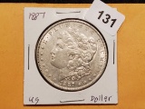 1887 Morgan Dollar in AU+