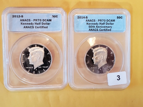 Two PERFECT ANACS-graded Kennedy Half Dollars