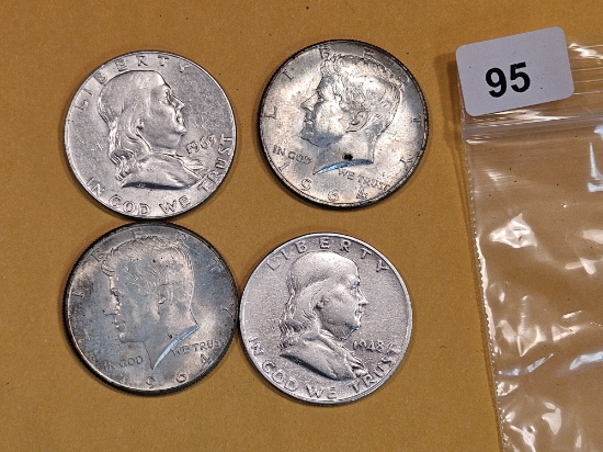 Four mixed silver half dollars