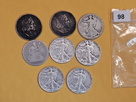 Eight mixed silver Half Dollars