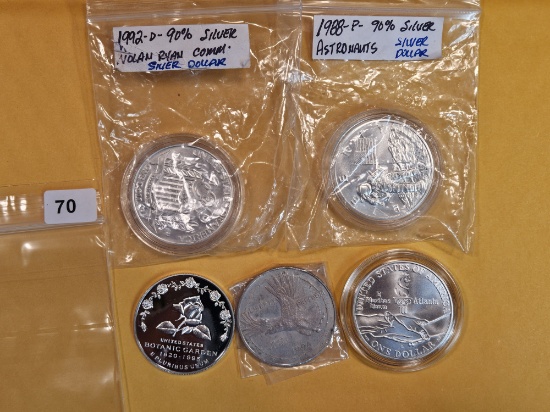 Five mixed Commemorative Silver Dollars