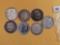 Seven mixed silver Half Dollars