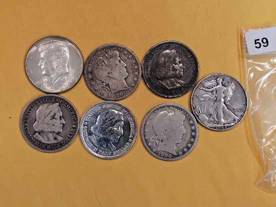 Seven mixed silver Half Dollars