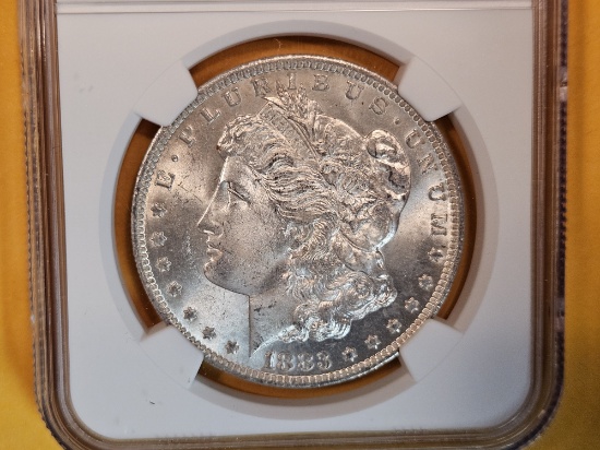 NGC 1883-O Morgan Dollar in Mint State 64
