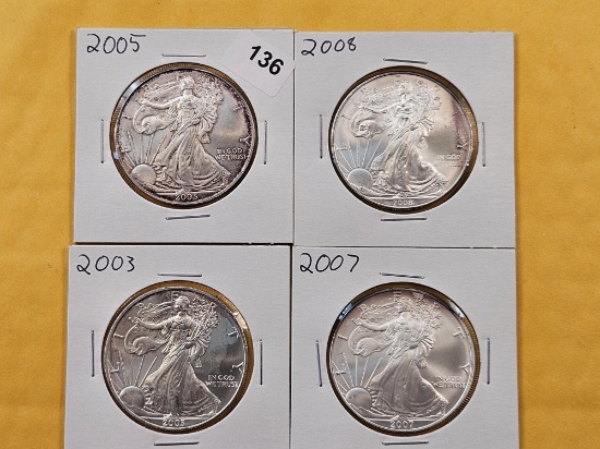 Four Uncirculated American Silver Eagles with Light Toning
