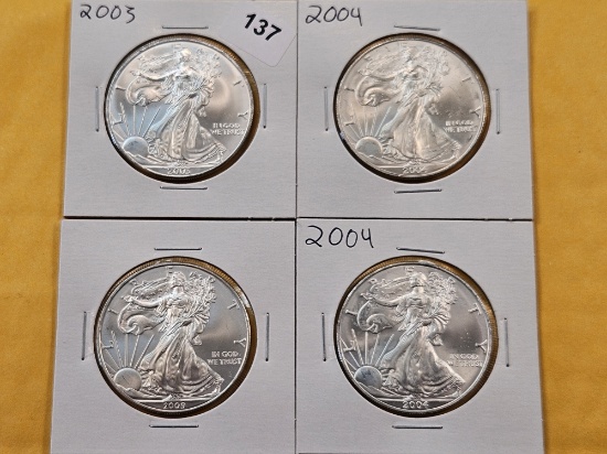 Four GEM Brilliant Uncirculated American Silver Eagles