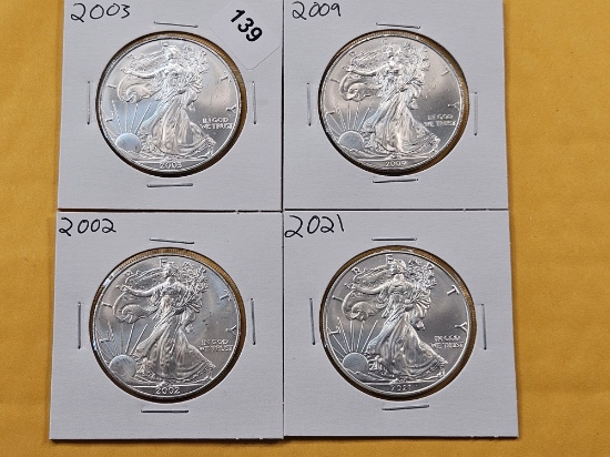 Four GEM Brilliant Uncirculated American Silver Eagles