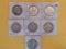 Seven mixed silver Franklin Half Dollars