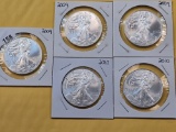 Five GEM Brilliant Uncirculated American Silver Eagles