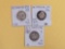 Three mixed silver quarters