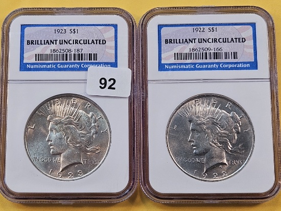 Two NGC Graded Brilliant Uncirculated Peace Silver Dollars