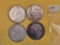 Four mixed Morgan Silver Dollars