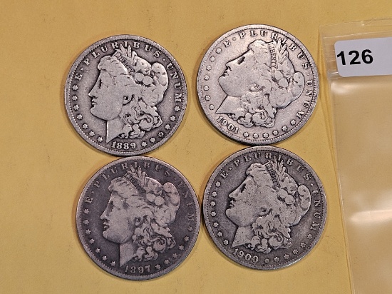 Four mixed Morgan Silver Dollars
