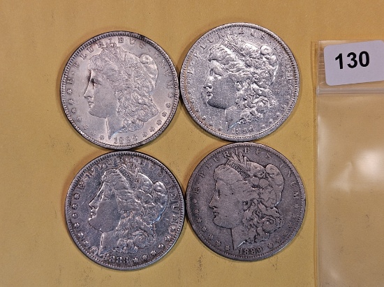 Four mixed Morgan Silver Dollars