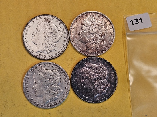 Four mixed Morgan Silver Dollars