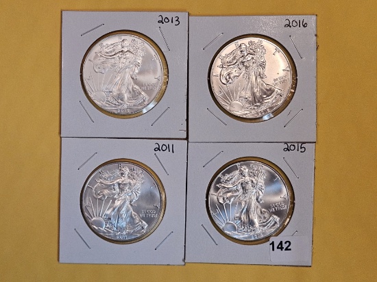 Four GEM Brilliant Uncirculated American Silver Eagles