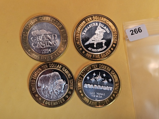 Four Silver center Ten Dollar Casino Gaming Tokens