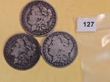 Three mixed Morgan Silver Dollars