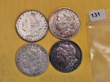 Four mixed Morgan Silver Dollars