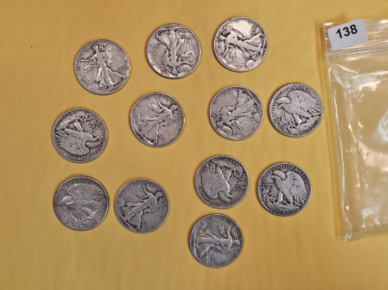 Twelve mixed silver Half Dollars