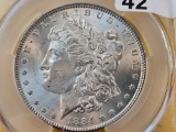 CAC 1884 Morgan Silver Dollar in Uncirculated -details