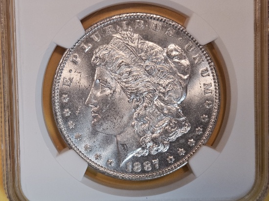 NGC 1887 Morgan Dollar in Mint State 62
