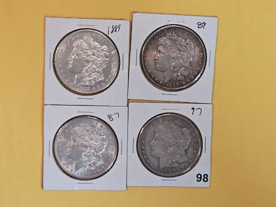 Four About Uncirculated Morgan Silver Dollars