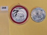 Two 1-Troy ounce .999 fine silver Proof art rounds