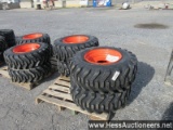 Set of 4 new 12-16. 5 sks332 tires on bobcat wheels, stock # 55003