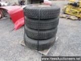 4 - 11r22. 5 rear drive tires and rims on pallet, stock # 55036