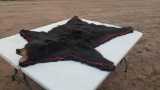 Very nice double felted black bear rug. 6 foot by 5 foot wide