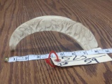 Relief carved warthog tusk