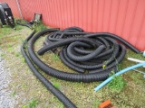 large lot of black drain pipe