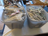 Two totes of clothes hangers