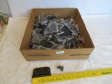 Lot of black hinges and screws