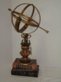 Vignette of Sphere On Stand & Books