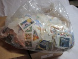 LOT OF WORLD WIDE STAMPS ON PAPER
