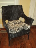 Wicker  Patio Chair w/Black & White Cushion.  Few spots where paint needs touching up