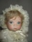 Beautiful Porcelain Faced Doll w/ Open Glass Eyes. Dressed in Sweet Christening Gown